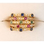 An 18ct yellow gold five band multi gem set ring, set with sapphires, rubies, emeralds & diamonds,