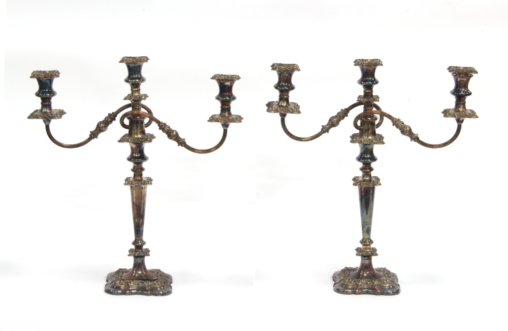 Property of a gentleman - a pair of early 19th century Old Sheffield Plate twin branch candelabra,