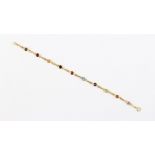 An unmarked yellow gold multi coloured gem set link bracelet, 7.9ins. (20cms.) long, approximately