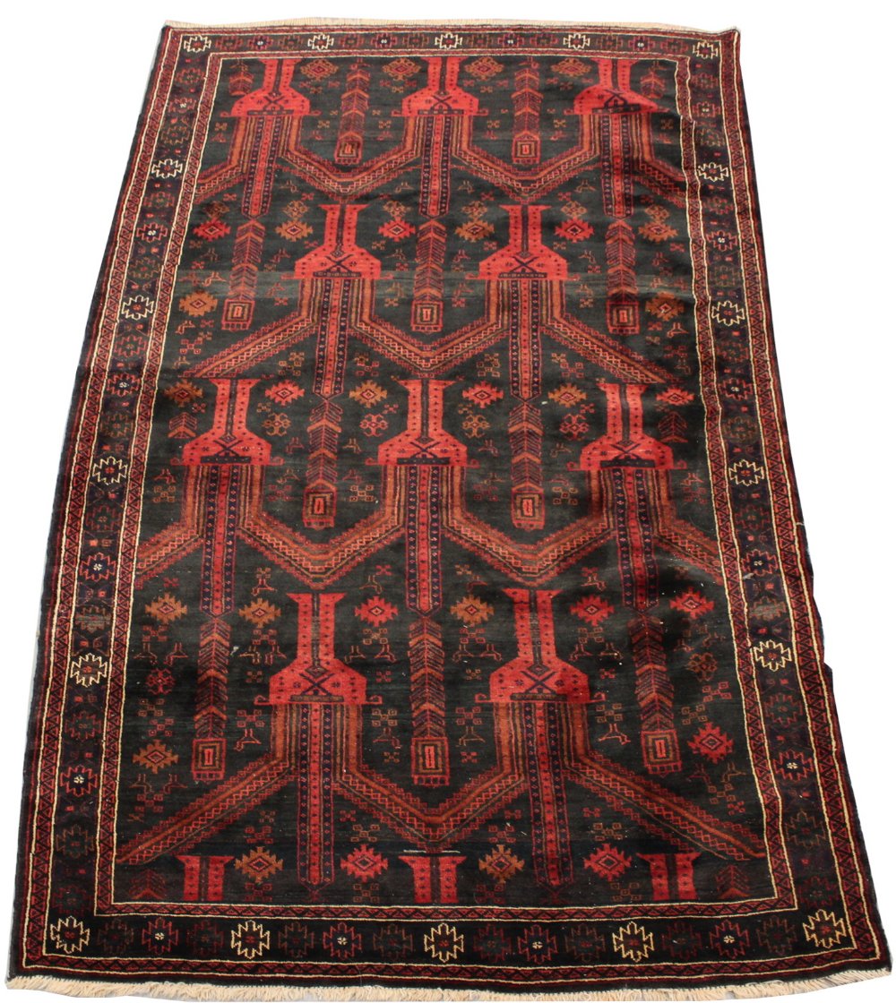 A Belouch woollen hand-made rug with dark red ground, 115 by 55ins. (294 by 140cms.) (see