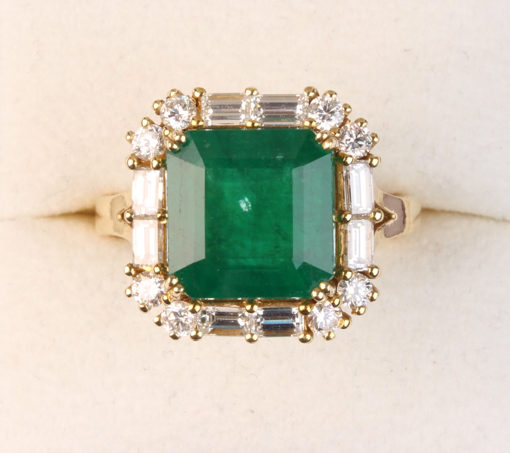 Property of a lady - an 18ct yellow gold emerald & diamond ring, the square cut emerald with cut