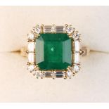 Property of a lady - an 18ct yellow gold emerald & diamond ring, the square cut emerald with cut