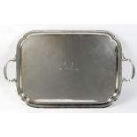 Property of a gentleman - a silver two-handled rectangular tray with re-entrant corners, with