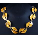 A Norwegian sterling silver & yellow enamel leaf link necklace, 15.5ins. (39.5cms.) long (see