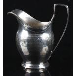 Property of a deceased estate - a George III silver helmet cream jug, with engraved foliate band,