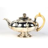 Property of a gentleman of title - an early 19th century George IV silver teapot, of melon form,