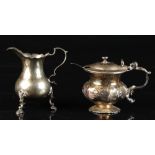 Property of a lady - an early George III silver baluster cream jug, with hoof feet, makers George