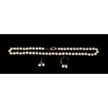 Property of a deceased estate - a uniform single row pearl necklace, with 9ct yellow gold clasp