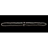 Property of a deceased estate - a graduated single row natural saltwater pearl necklace, with