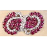 A fine pair of ruby & diamond clips, joining to form a brooch, set with thirty-five unheated Burmese