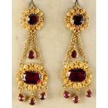 A pair of early 19th century Georgian gold cannetille filigree garnet pendant earrings, each