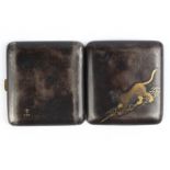 A Japanese mixed metal damascene inlaid cigarette case, decorated with a tiger, gold fan mark