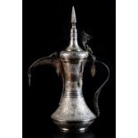 Property of a lady - a Middle Eastern white metal (tests silver) ewer or coffee pot, probably