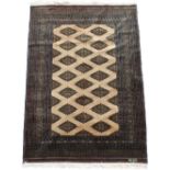 Property of a lady - a good Bokhara design rug, with signature tablet, 72 by 49ins. (183 by 125cms.)