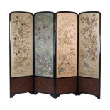 A Japanese four-panel screen, late 19th / early 20th century, with embroidered silk panels depicting