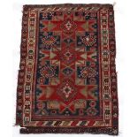 Property of a gentleman - an antique Caucasian Kazak rug, 69 by 49ins. (175 by 125cms.) (see