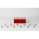 Property of a lady - a set of twelve Thai silver place name holders, each with a different figure (