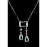 An aquamarine & diamond pendant necklace, with rectangular cut aquamarine above two pear shaped