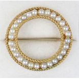 Property of a lady - an 18ct yellow gold pearl openwork circular brooch, the twenty-eight pearls