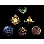 A collection of six enamel brooches including a Victorian mourning locket brooch, an 18ct gold &