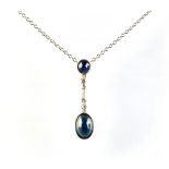 A French Art Deco style 18ct white gold sapphire & diamond necklace, the two cabochon sapphires