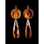 A pair of unmarked yellow gold & amber pendant drop earrings, each 1.75ins. (4.4cms.) long (2) (