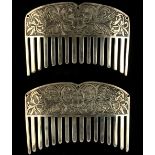 A pair of white metal hair slides or combs, with engraved scrolling foliate decorations, each 3.