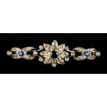 An early 20th century yellow gold sapphire & rose cut diamond floral brooch, the three sapphires