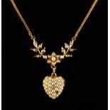 A 15ct yellow gold seed pearl necklace with heart shaped pendant centred by a diamond, suspended