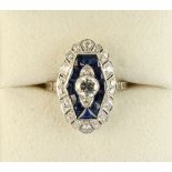 An Art Deco 14ct white gold sapphire & diamond ring, the central brilliant cut diamond approximately