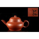 A small early 20th century Chinese Yixing teapot, 4-character mark to underside (see illustration).