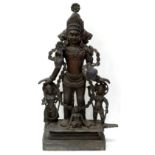 Property of a lady - a large Indian bronze figure of a deity with attendants, 25.5ins. (65cms.) high