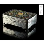 A Japanese silver & enamel rectangular box, Meiji period (1868-1912), the hinged cover decorated