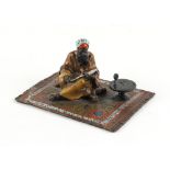 Property of a gentleman - after Franz Bergman - a cold painted bronze figure of a seated Arab