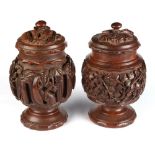 Property of a lady - two similar Indian carved hardwood tea caddies or urns & covers, late 19th /
