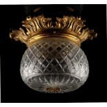 Property of a lady - an ormolu foliate ceiling light, with cut glass shade, 10.65ins. (27cms.)