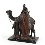 Property of a gentleman - a cold painted spelter table lighter modelled as an Arab carpet seller