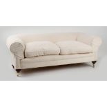 Property of a lady - a late Victorian chesterfield sofa, with later cream upholstery, on turned