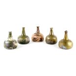 Property of a lady - a collection of five early 18th century onion shaped wine bottles, with high