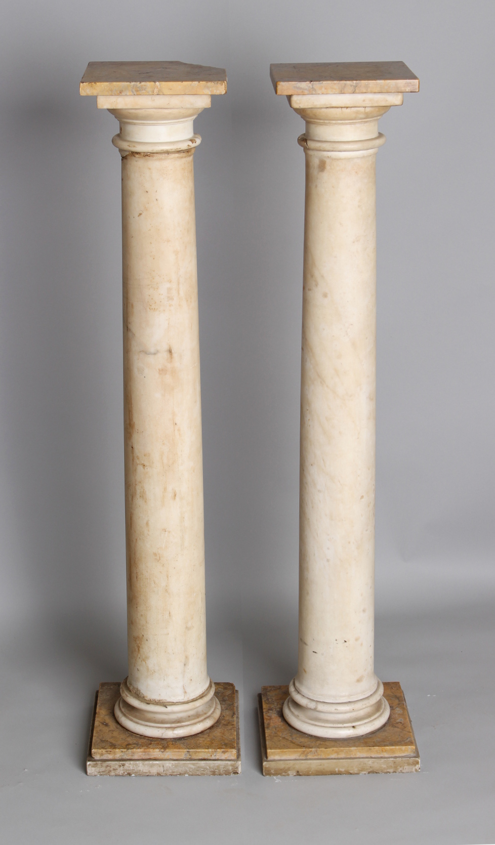 Property of a deceased estate - a pair of white & siena marble columns, some damages, each 43.25ins.