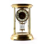 Property of a lady - a late 19th century French brass oval cased four glass mantel clock, the 8-