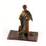 Property of a gentleman - after Bruno Zach - a cold painted bronze figure of an Arab cloth seller,