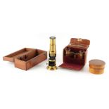 Property of a lady - an early 20th century mahogany cased brass student's microscope; together