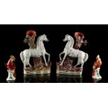 Property of a lady - a pair of Victorian Staffordshire horse spill vases, each approximately 11.