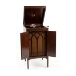 Property of a lady - an HMV oak cabinet gramophone, with Harrods label numbered 41353 (see