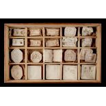 A collection of twenty plaster moulds, the largest 3ins. (7.5cms.) long (20) (see illustration).