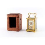 Property of a lady - a small late 19th century French brass corniche cased carriage clock with