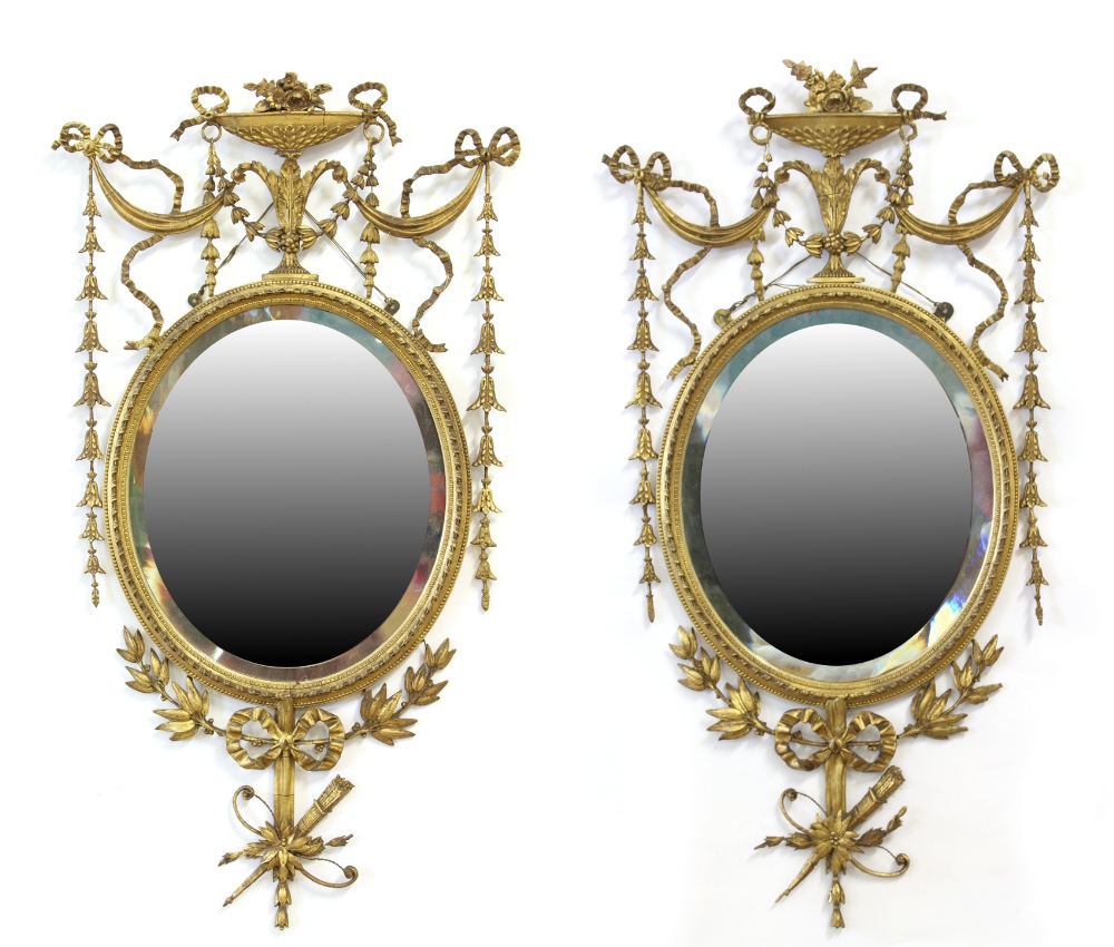 Property of a deceased estate - a pair of late 19th century gilt oval framed wall mirrors with