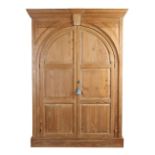 Property of a deceased estate - a pine architectural cupboard, parts Georgian, the two arched