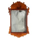 Property of a gentleman - an early 20th century burr walnut fretwork framed wall mirror, with